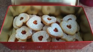 Linzer cookies in a tin