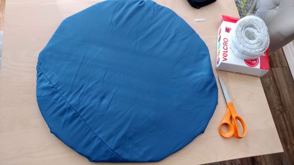 circular seat pad covered in blue fabric