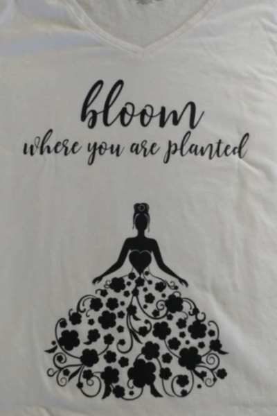 black vinyl sentiment and girl in a flower dress on a T-shirt