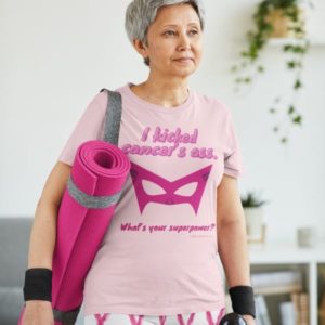 T-shirt mockup of a senior woman ready for yoga class. T-shirt design reads: I kicked cancer's ass. What's your superpower?